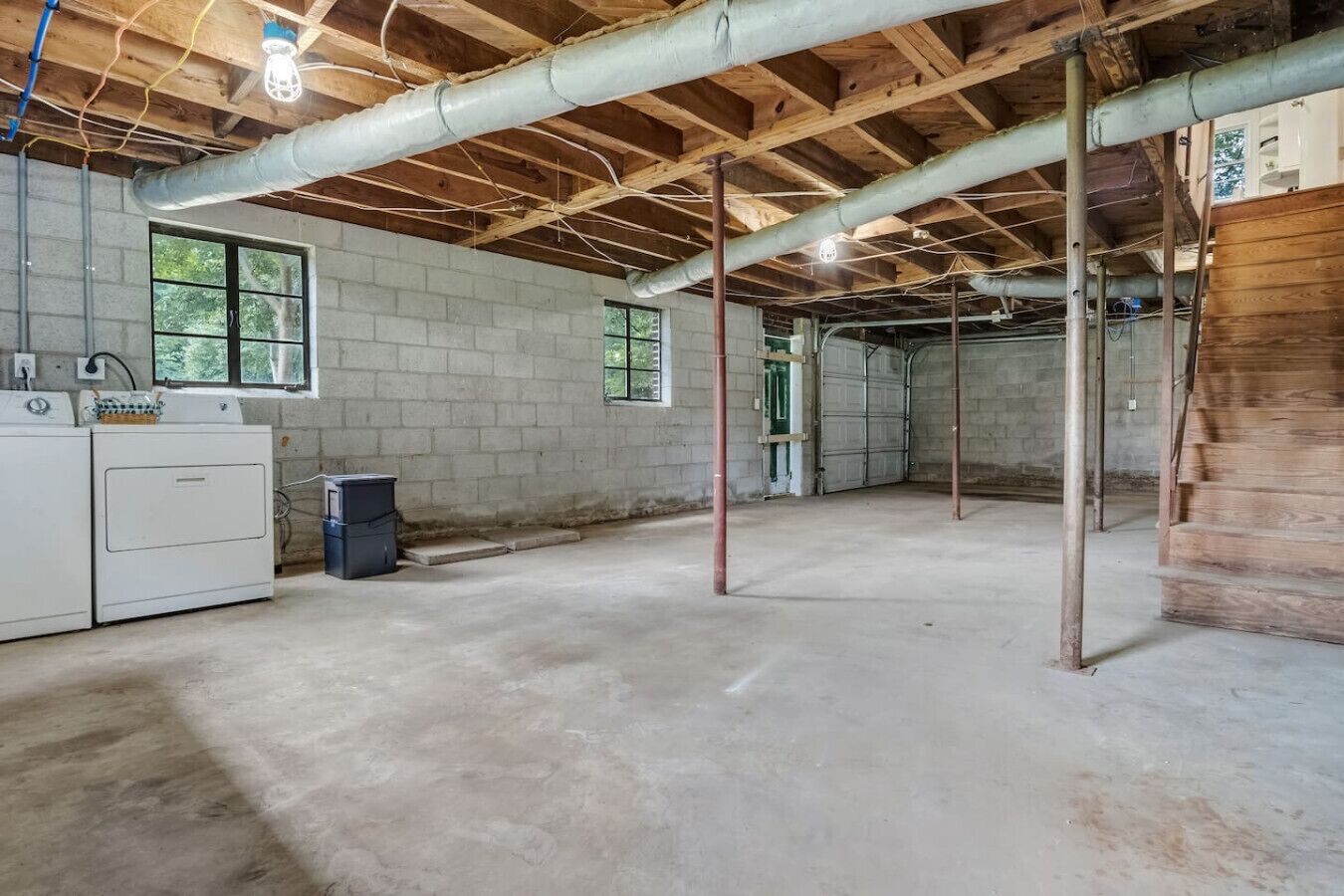 Garage is available with one car parking spot and fold-up ping pong table.  Free washer and dryer access and stair access up to main floor