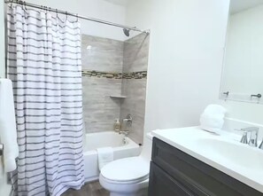 Shower, hair dryer, towels, soap