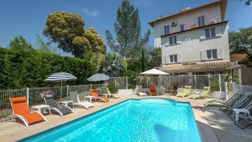 Seasonal outdoor pool, pool umbrellas, pool loungers