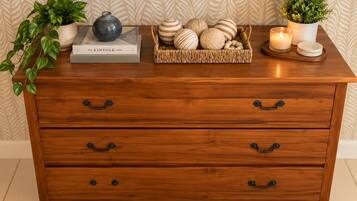 Keep belongings organized in a stylish wooden dresser with room for essentials.