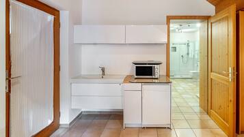 Fridge, microwave, stovetop, coffee/tea maker