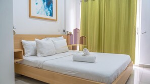 Deluxe-Studiosuite, Balkon, Stadtblick | Bügeleisen/Bügelbrett, kostenloses WLAN, Bettwäsche