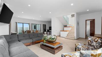 Villa | Living area | 65-inch LED TV with cable channels