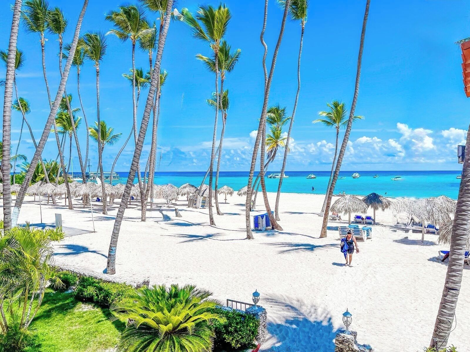 On the beach, white sand, beach towels, beach massages