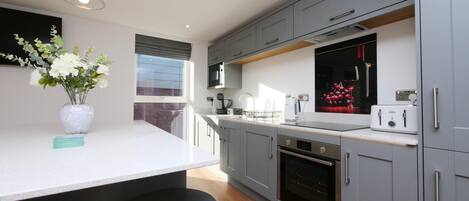 Fridge, microwave, coffee/tea maker, dining tables