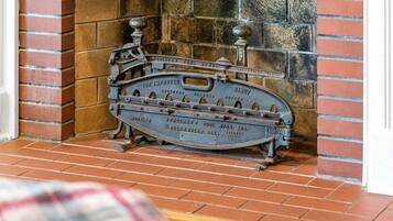 A vintage tool chest against a brick wall.
