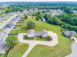 A residential area with houses, green lawns, and a central driveway. - Whitt Lane (Clarksville)