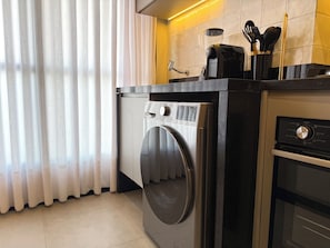 Premium Apartment, Balcony, City View | Laundry