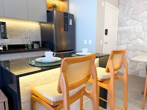 Premium Apartment, Balcony, City View | In-room dining