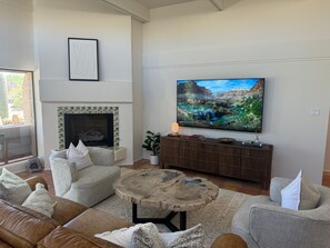 Smart TV, fireplace, books