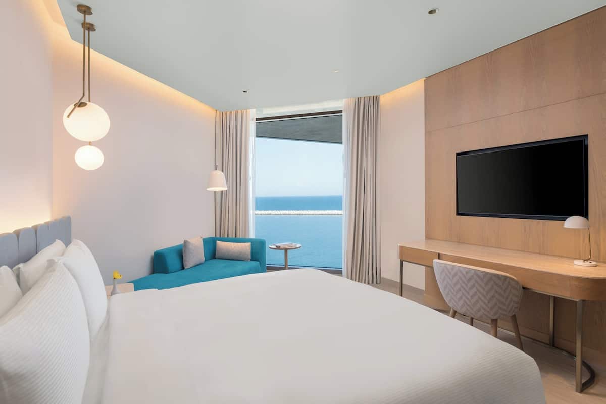 Chambre Deluxe, 1 trÚs grand lit, vue sur la mer | Draps en coton égyptien, literie de qualité, couette en duvet, minibar