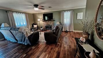 Smart TV, fireplace, books, music library