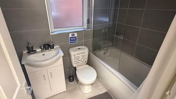 Shower, towels, soap, toilet paper