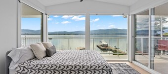 Serene Lakefront Haven: 4BR, Hot Tub & Private Beach