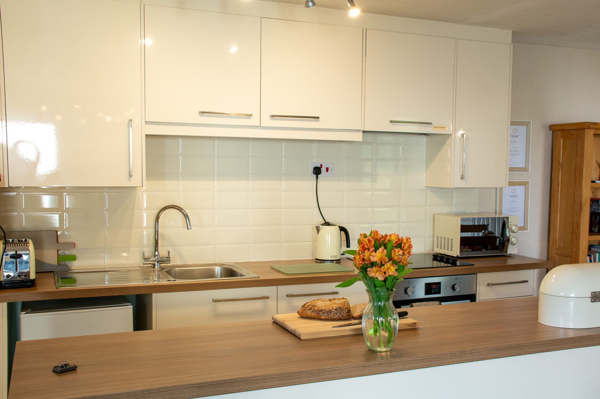 Fridge, microwave, toaster, dining tables