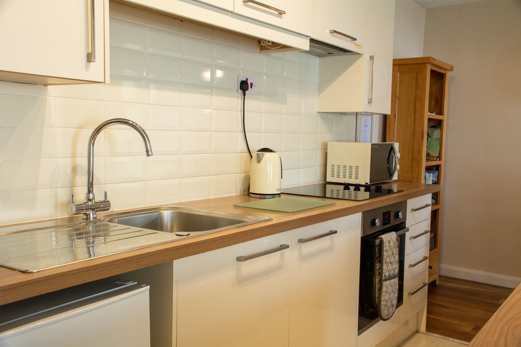 Fridge, microwave, toaster, dining tables