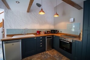 Fridge, microwave, toaster, dining tables