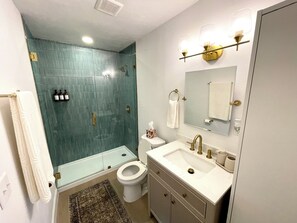 Shower, hair dryer, towels, soap