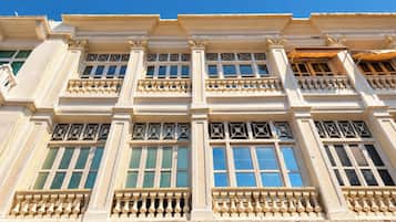 A building facade with multiple windows and balconies.