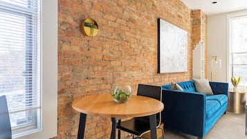 Classic Apartment, 1 Queen Bed | Living area | 55-inch TV with digital channels, streaming services