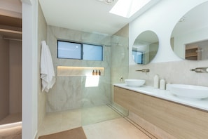 Shower, towels, soap, toilet paper