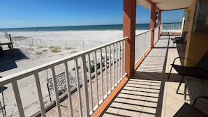 A balcony with a view of a beach and ocean. - Beach & Relaxation, 2BR, Family + Dog Friendly (Redington Shores)