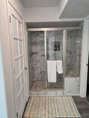 Shower, hair dryer, towels, soap