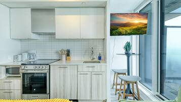 Comfort Suite, City View | Private kitchen | Full-size fridge, microwave, oven, stovetop