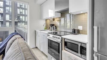 Signature Apartment, City View | Private kitchen | Full-sized fridge, microwave, oven, stovetop