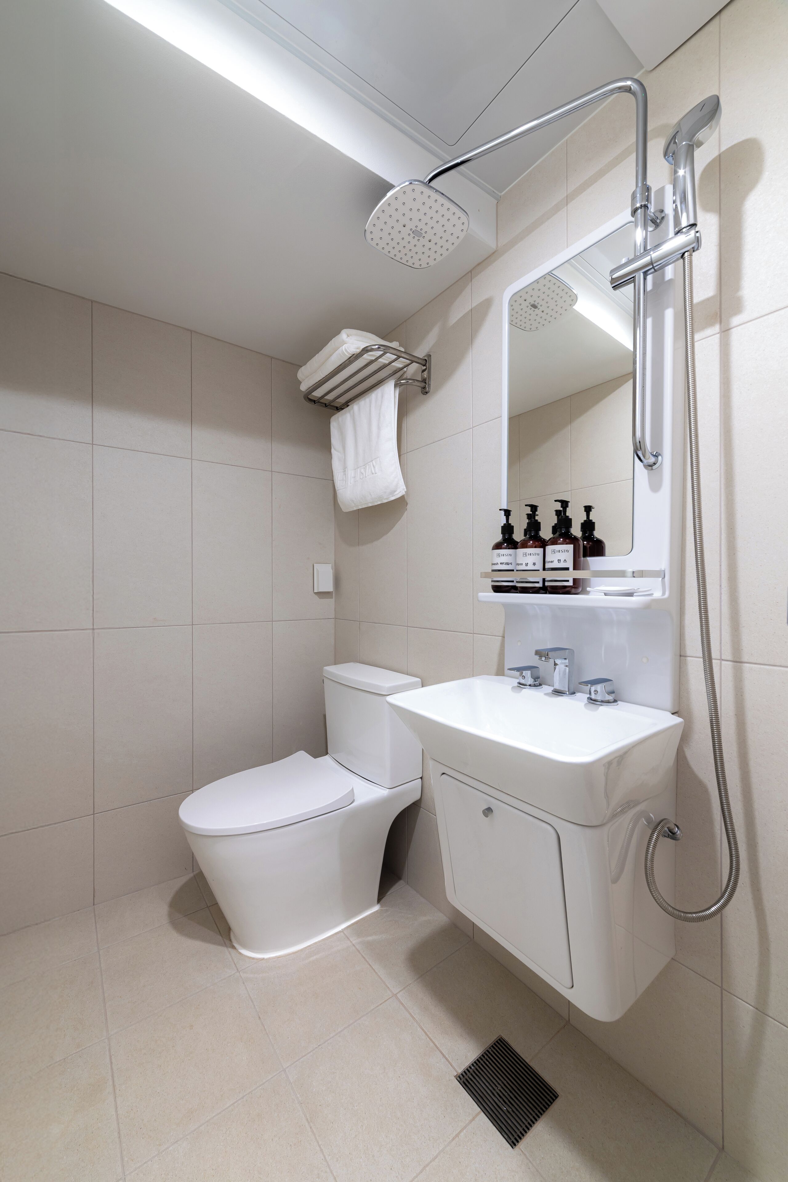 Shower, hair dryer, slippers, towels