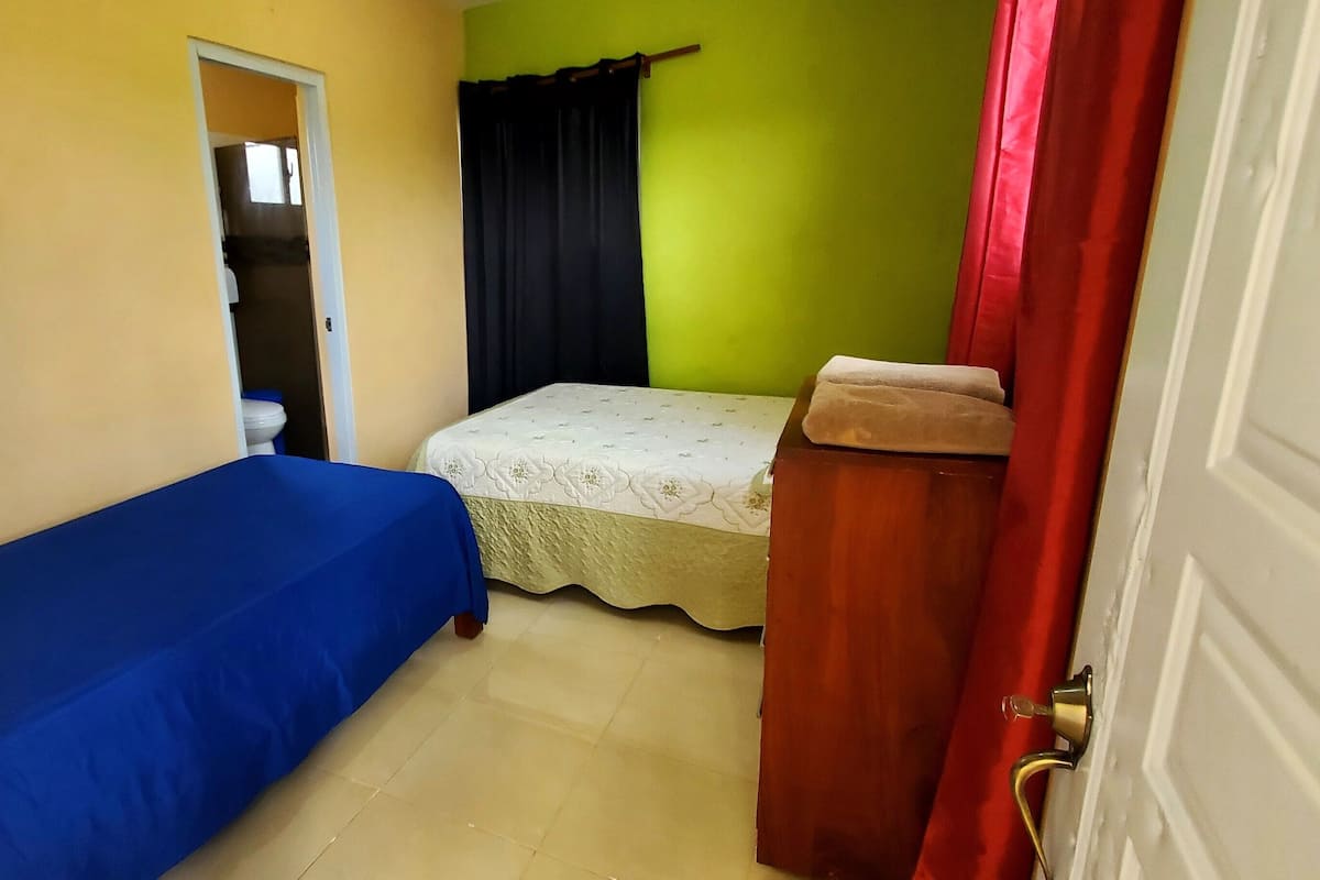 Family Triple Room, Garden View | Laptop workspace, free WiFi