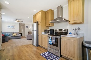 Fridge, microwave, oven, stovetop - Modern 3BR Home — King Suite, Fire Pit, 5 Min to Lake Erie Beach (Port Clinton)
