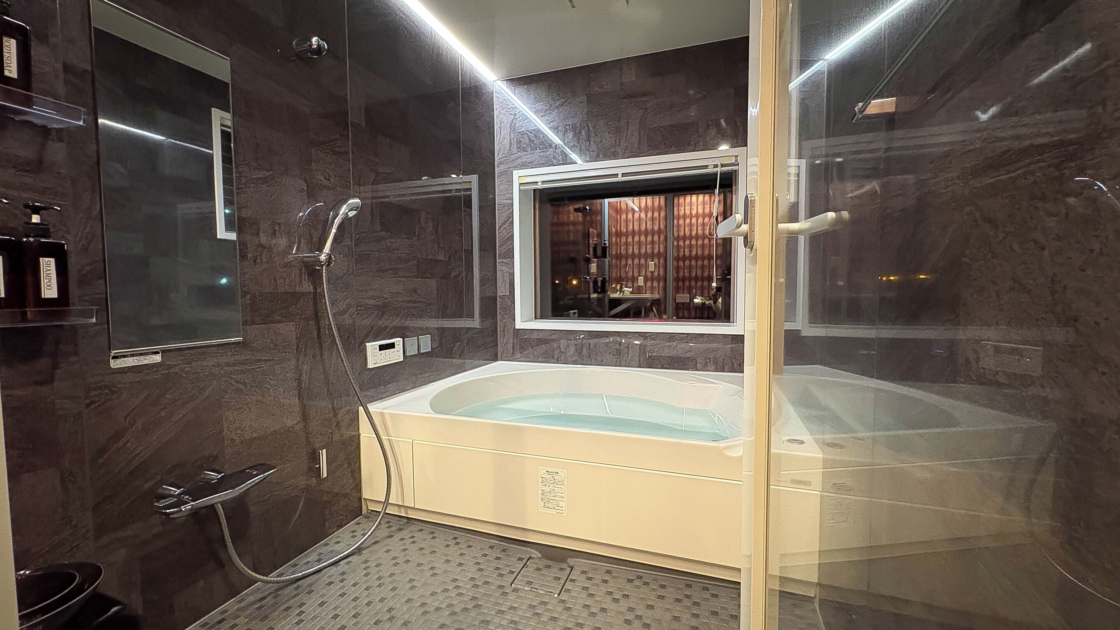 Combined shower/tub, hair dryer, towels, soap