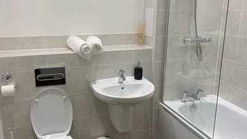 Shower, towels, toilet paper