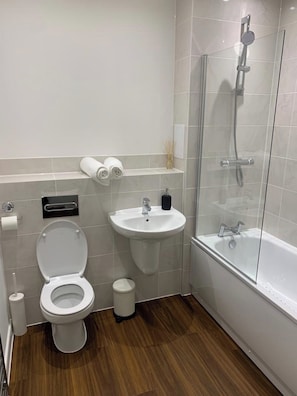 Shower, towels, toilet paper