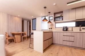 Fridge, microwave, stovetop, coffee/tea maker