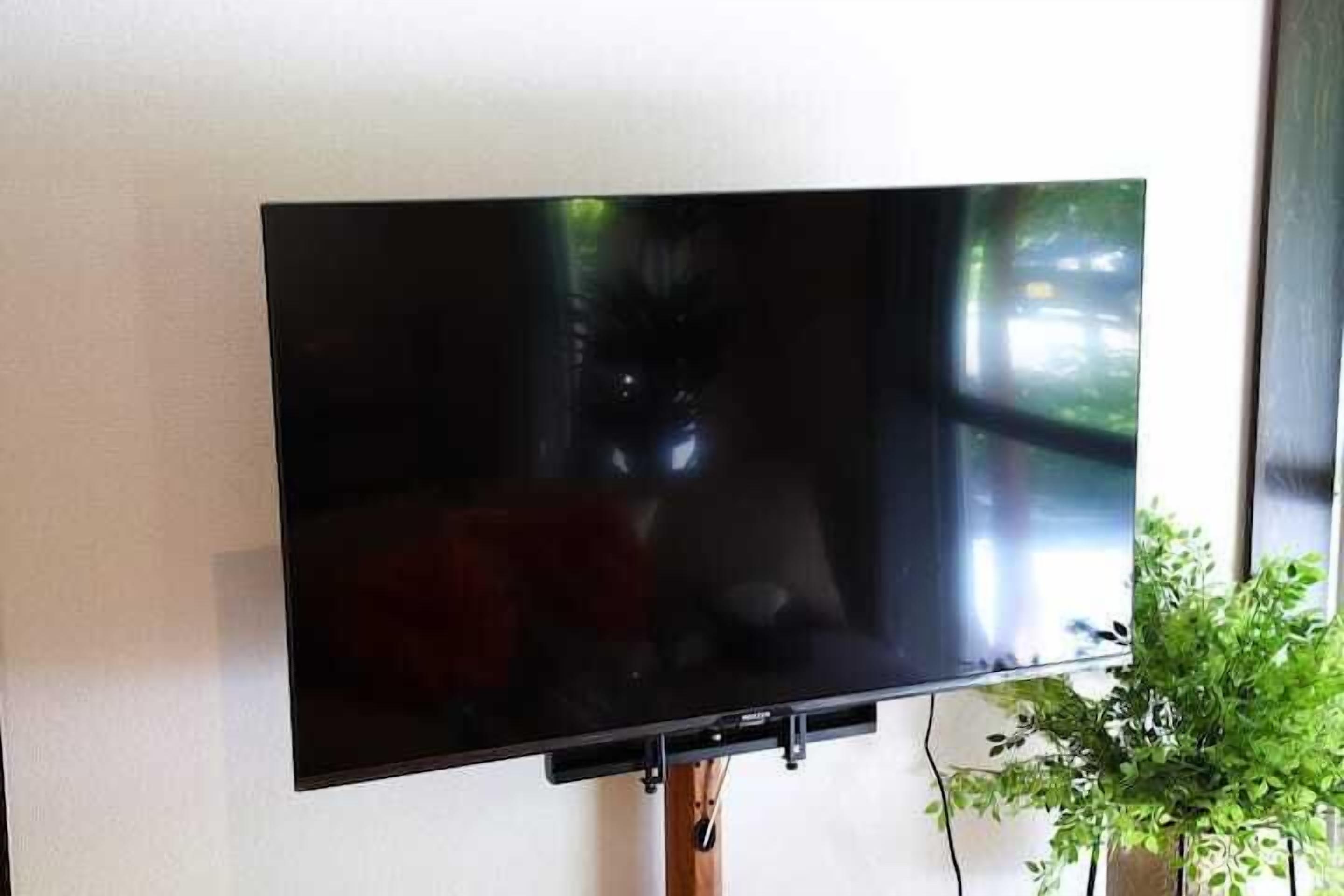 A flat-screen TV mounted on a wall.