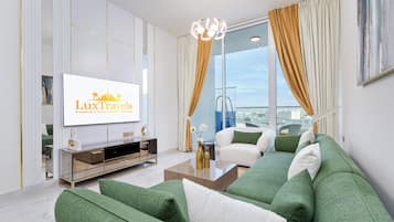 Signature Apartment, City View | Living area | 55-inch Smart TV with cable channels, Netflix, streaming services