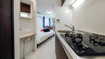 Fridge, microwave, stovetop, cookware/dishes/utensils