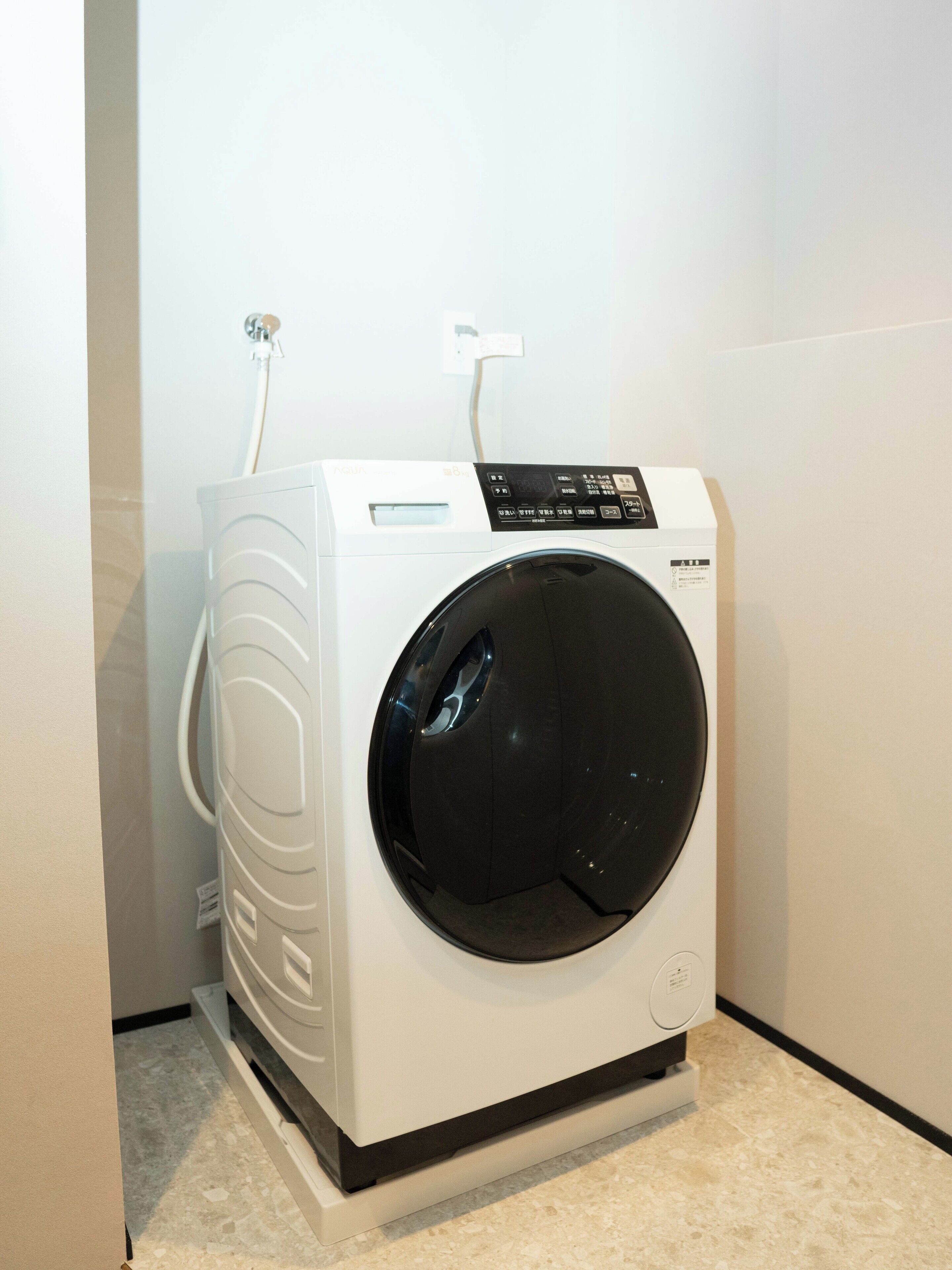 Shower, hair dryer, towels, shampoo