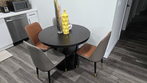 A modern kitchen with a dining area. - Self place to enjoy it (Edmonton)