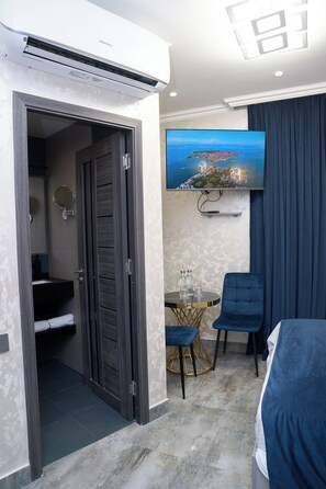 Economy Double Room, City View | In-room safe, blackout drapes, soundproofing, iron/ironing board