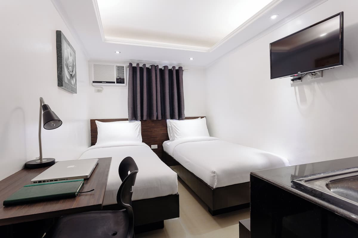 Habitación Deluxe con 2 camas individuales | Escritorio, espacio para trabajar con laptop y wifi gratis