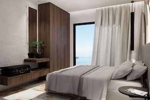 A modern bedroom with a bed, a nightstand, a suitcase, a potted plant, and a view of the sea.