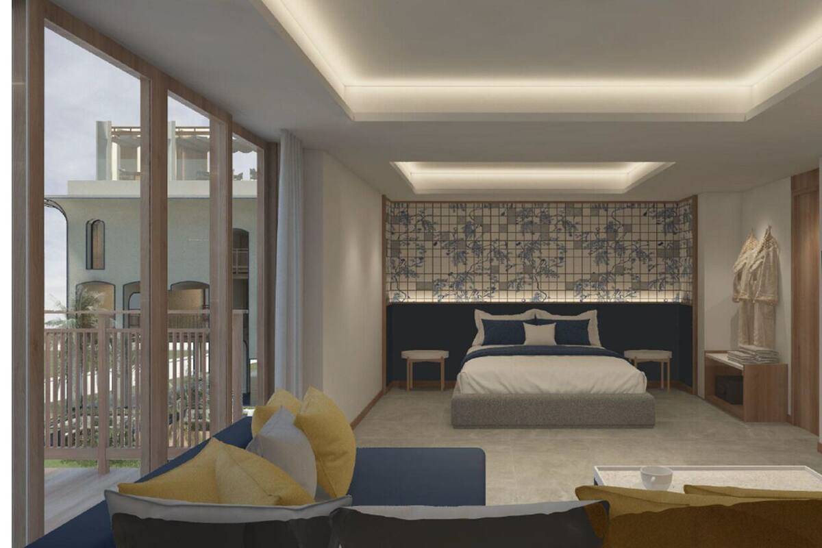 Un dormitorio moderno con una cama grande, televisión y vistas al balcón.