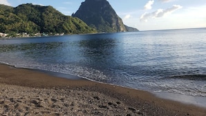 A beach with a mountain in the background. - 1 Unit with Balcony | On-site Pool (Palmiste)