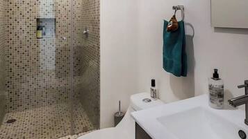 Shower, hair dryer, towels, soap