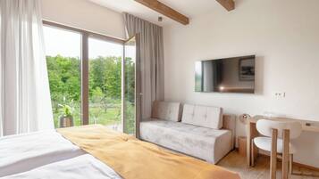 Deluxe Suite, Garden View | Desk, laptop workspace, free WiFi