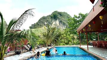 Outdoor pool, pool umbrellas, pool loungers