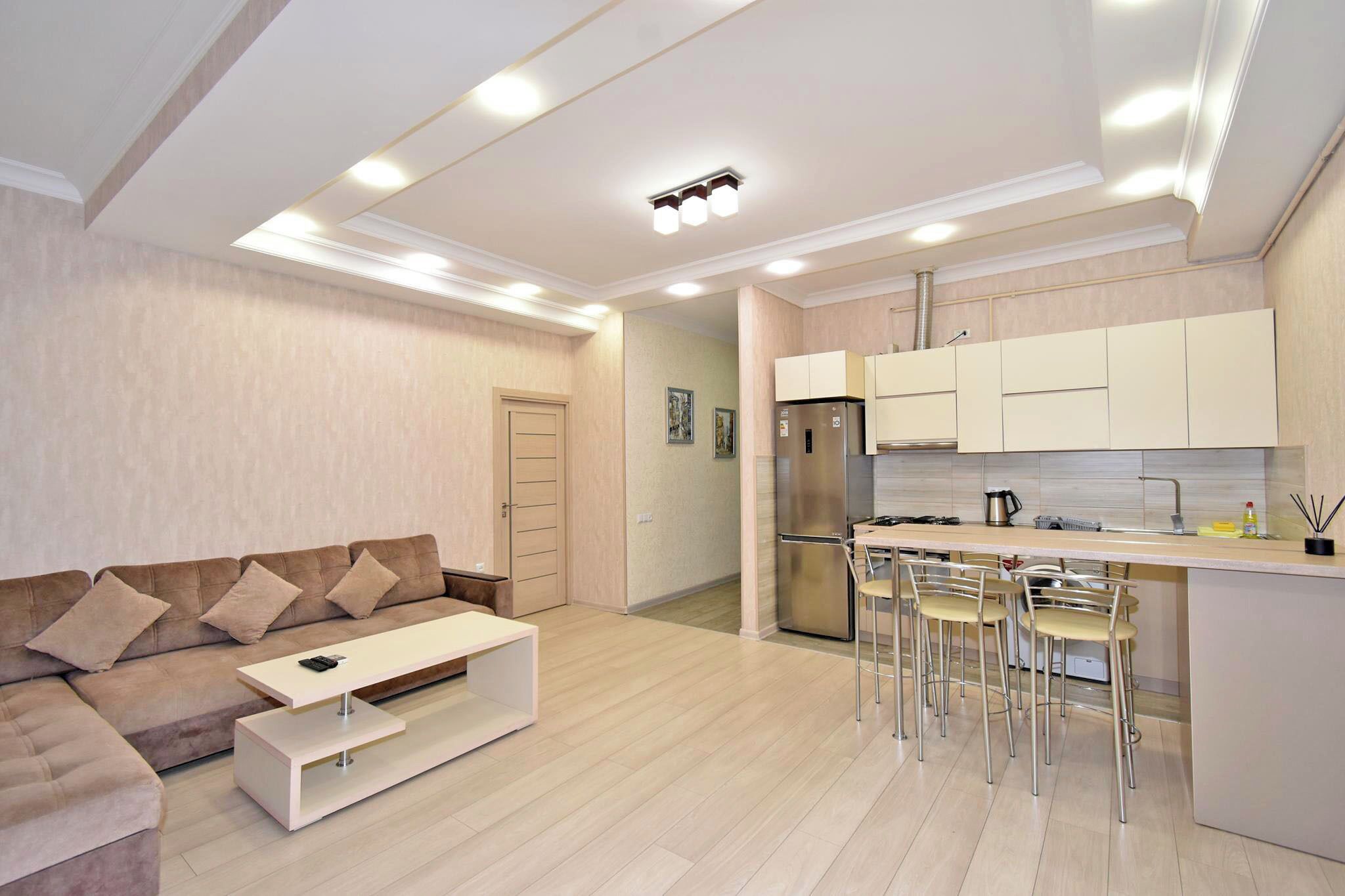 Apartment, 2 Bedrooms | Living area | 50-inch flat-screen TV with cable channels